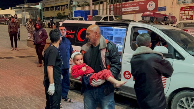 A Palestinian child wounded in an Israeli strike is rushed into Nasser hospital, in Khan Younis 