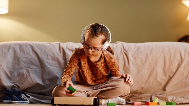 Girl with Down Syndrome Playing 