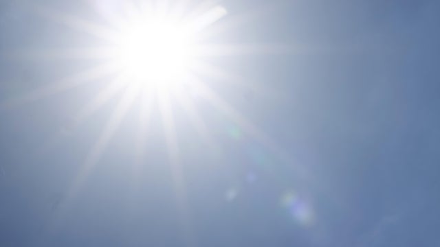 Full bright sun in the blue sky 