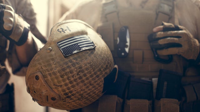American flag on helmet of US Marine soldier. 